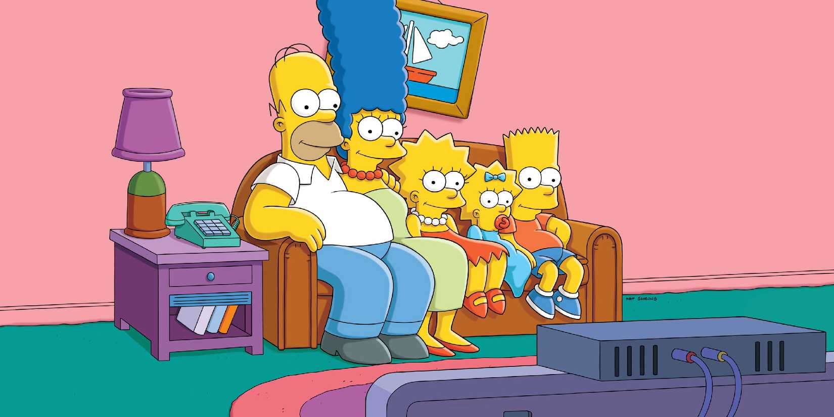 The Simpsons sitting in front of a TV.